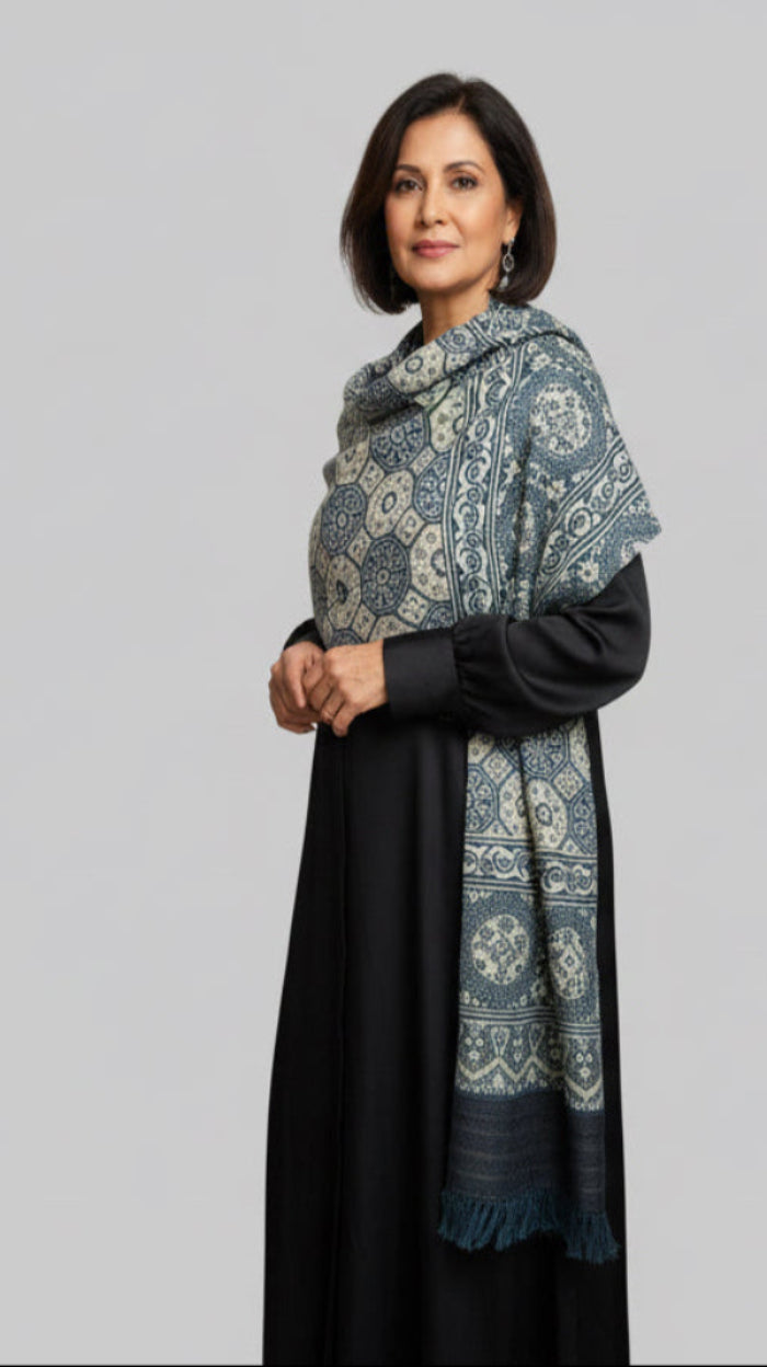 Woman wearing a black dress with Ajrakh - Indigo geometric circles fine wool shawl
