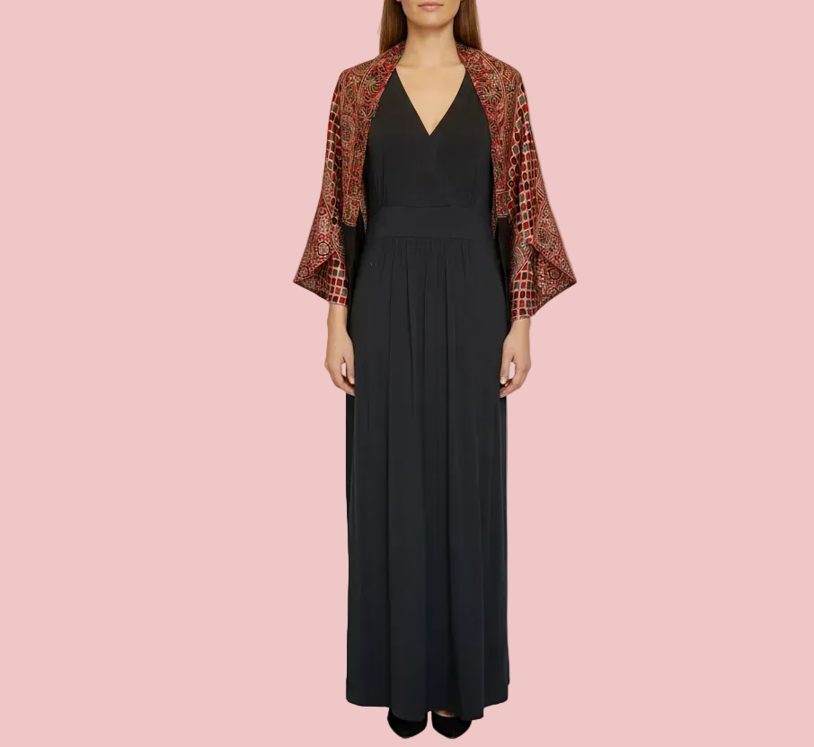 Woman wearing a modal silk shrug with red and black ajrakh patterns