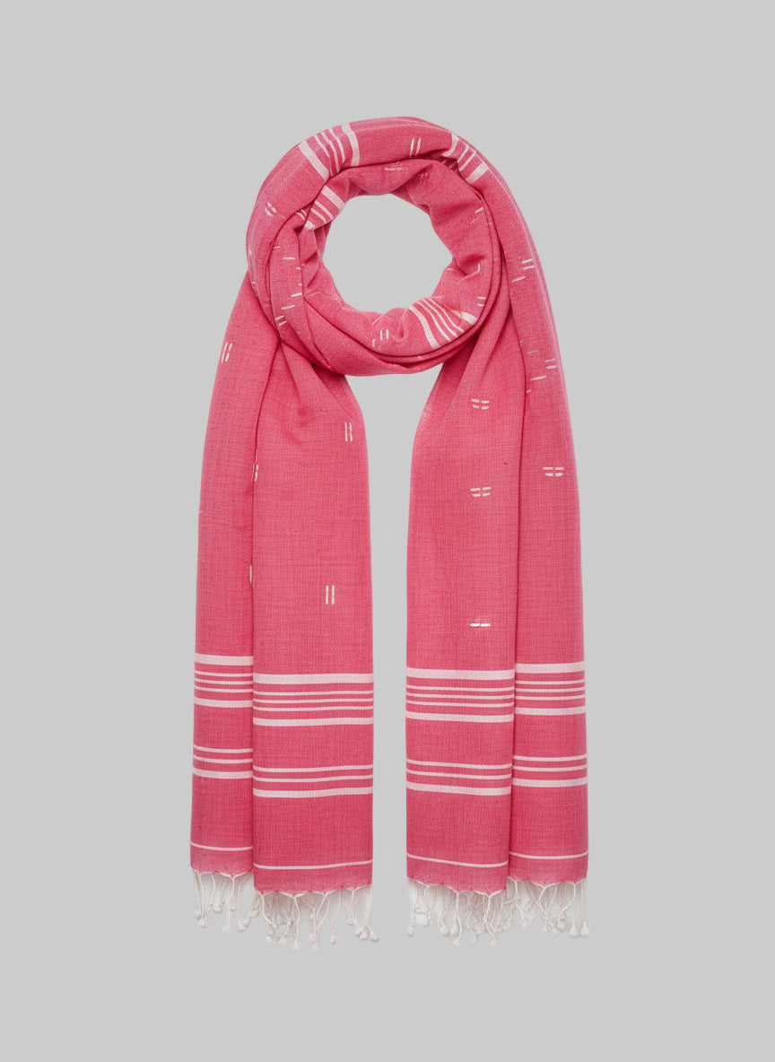 A pink scarf with white Jamdani stripes and diamonds and tassels