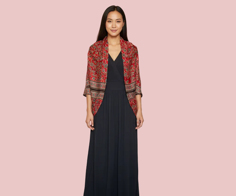 Eden luxurious Modal Silk in floral pattern - Red patterned shrug draped over a black dress 