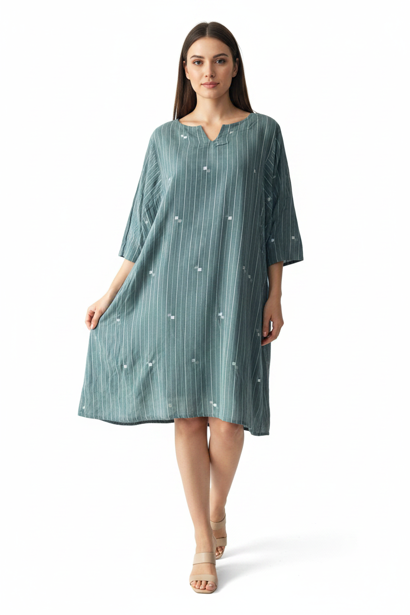 teal Green striped dress in muslin jamdani on a woman 